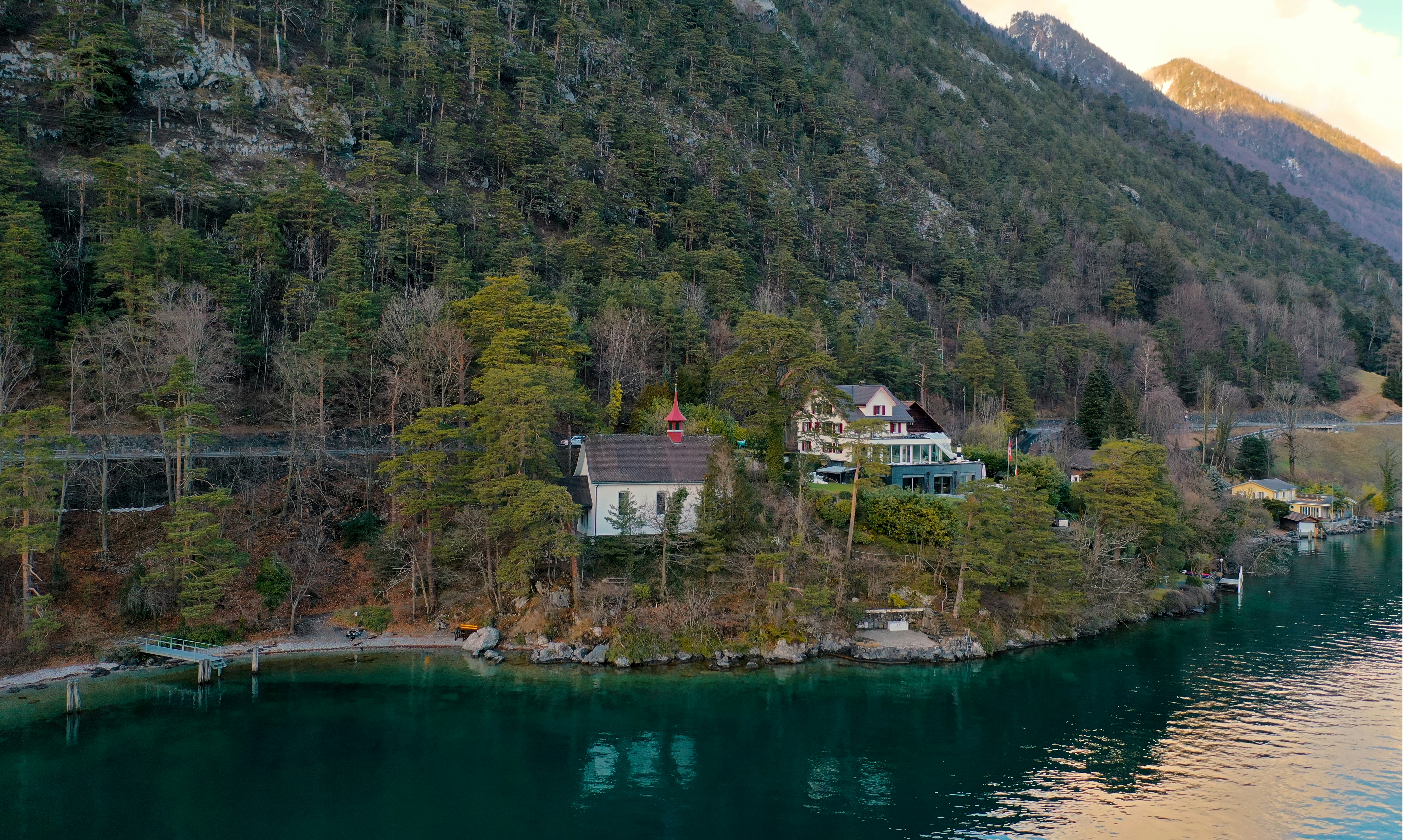 houses near lake and mountain